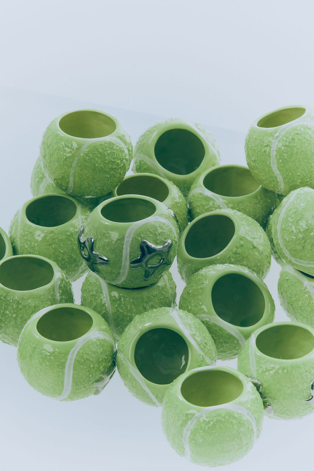 'ace' ceramic tennis ball cup