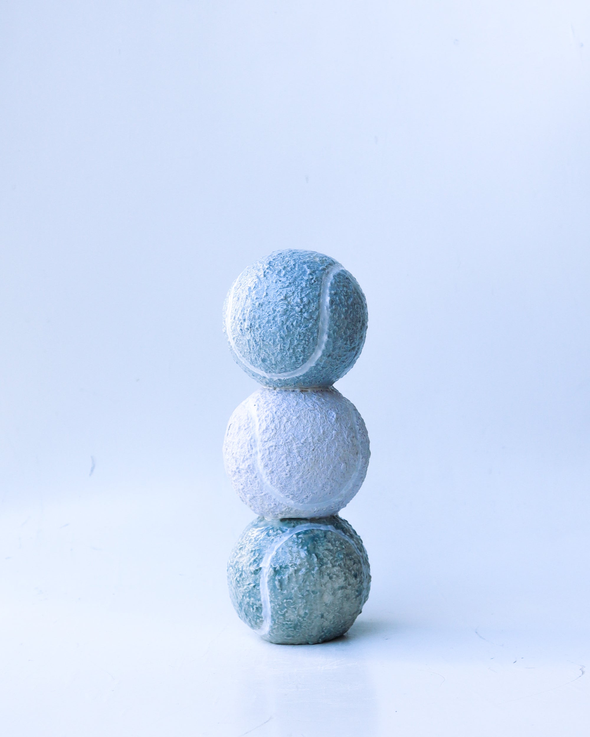 'solem' tennis ball trio sculpture